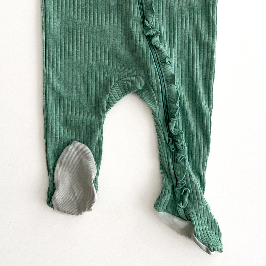 Green ribbed ruffles on front sleepsuit