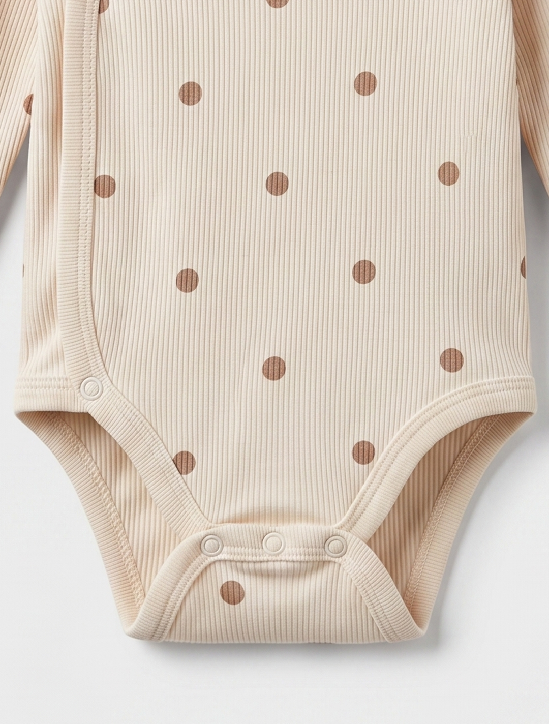 BEIGE POLKA DOTTED WRAPOVER ONESIE