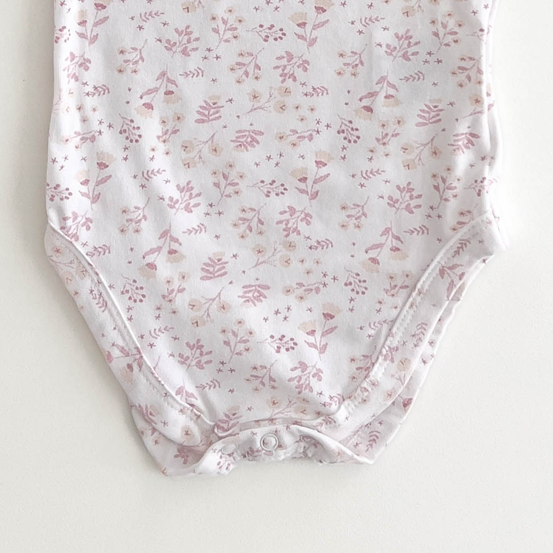 PINK FLORAL PATTERNED ONESIE