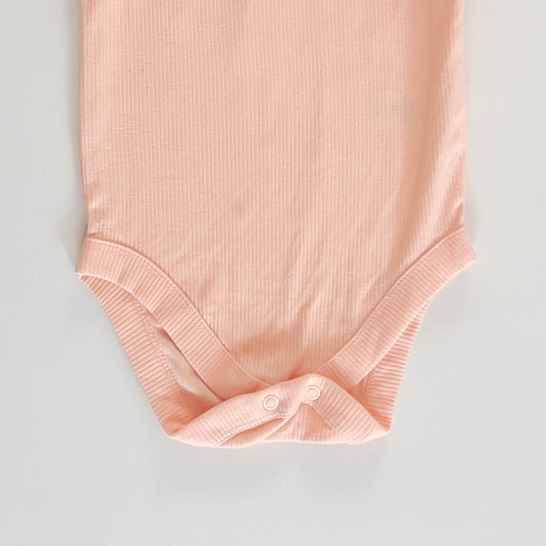 PEACH RIBBED ONESIE