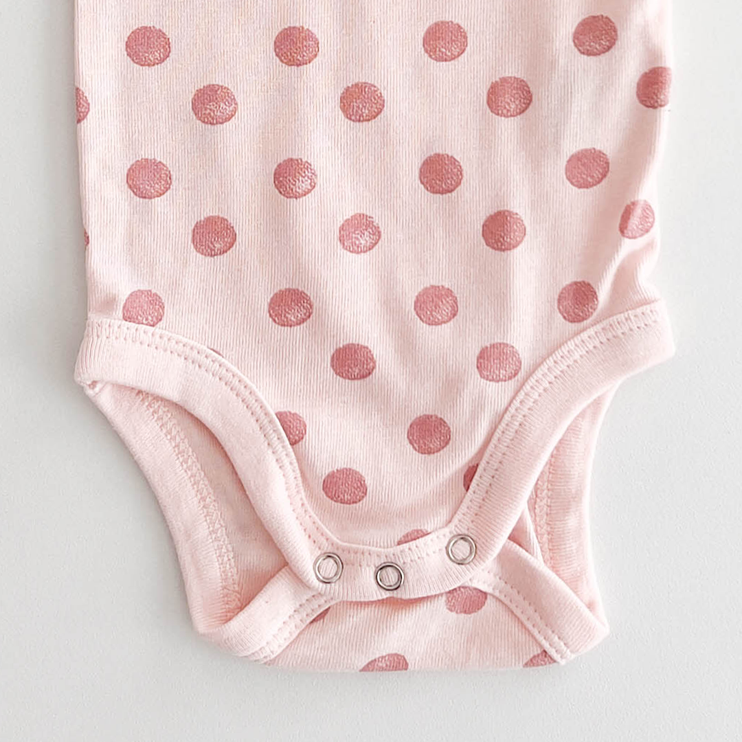 PEACH POLKA DOTTED ONESIE