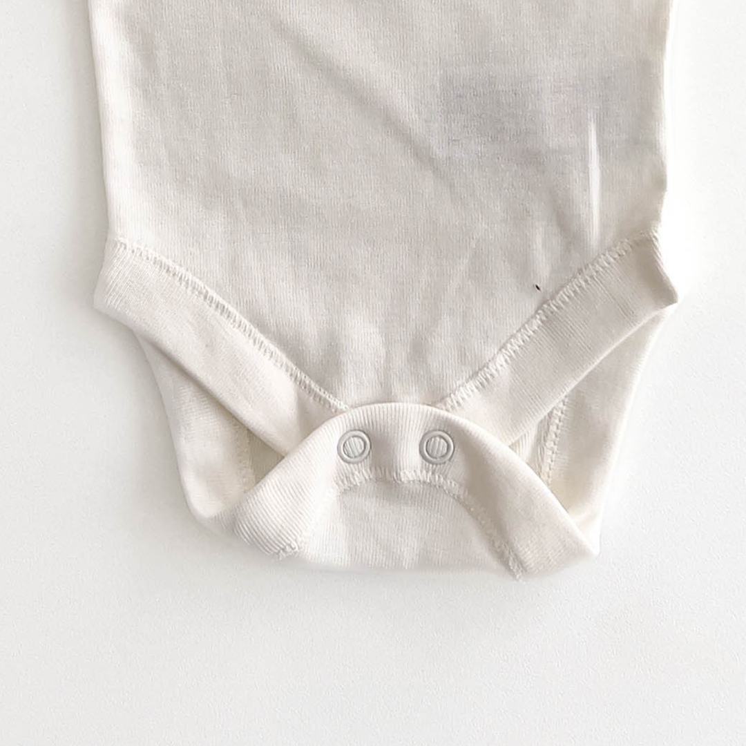 M&S LION PRINT WHITE ONESIE