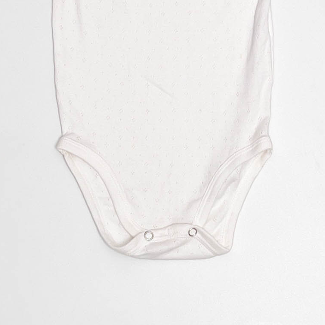WHITE POINTELLE SLEEVELESS ONESIE