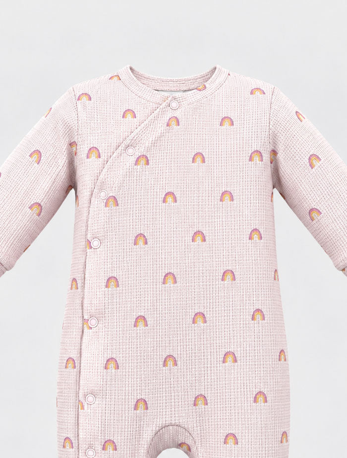 Dusty pink knitted rainbow sleep suit