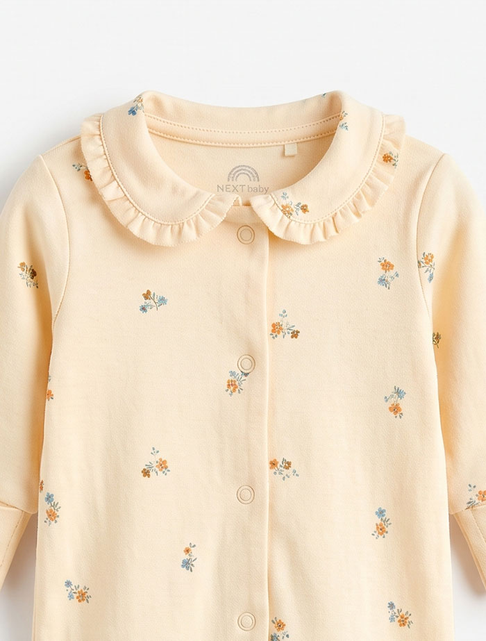 Pastel floral ruffled sleep suit