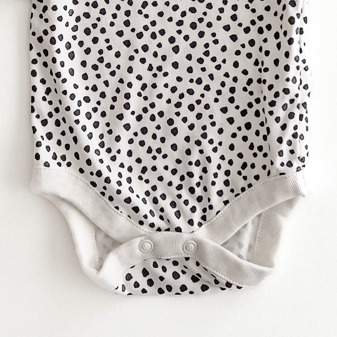 NEXT BABY BLACK AND WHITE PATTERNED ONESIE