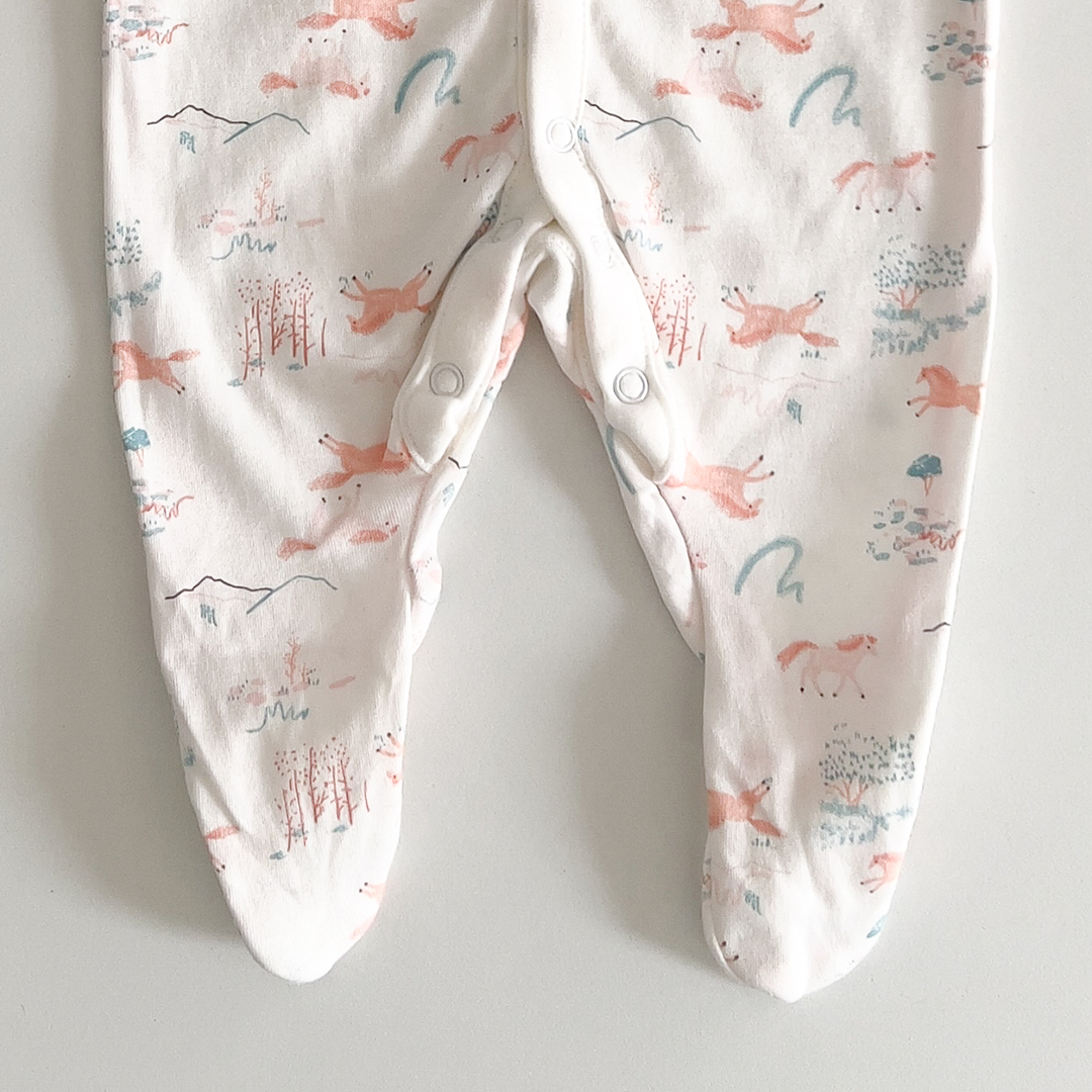 White and blue patterned sleepsuit