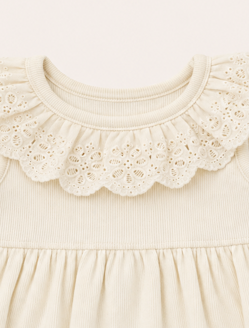 Off white ruffled onesie