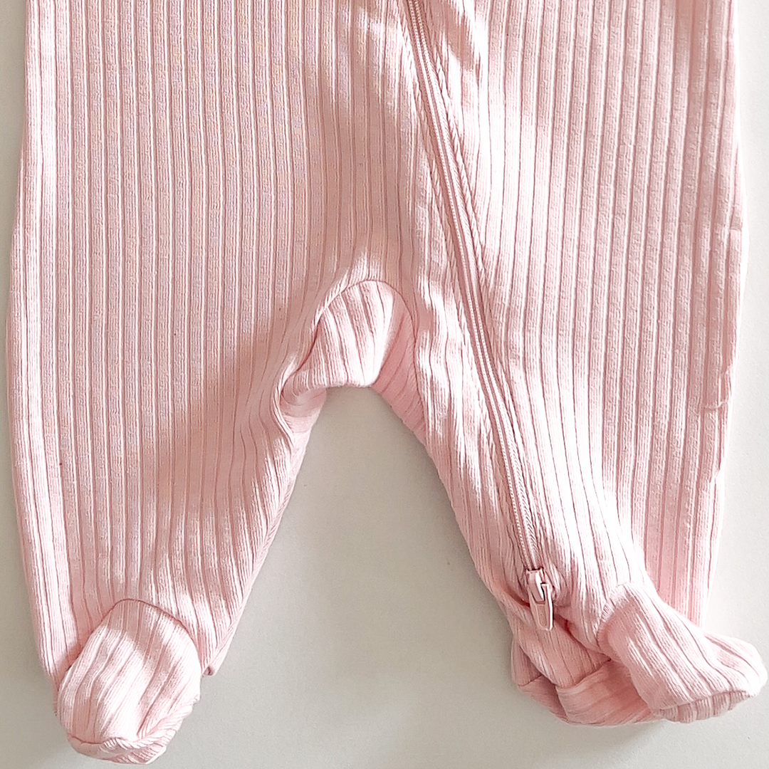Pink ribbed sleepsuit