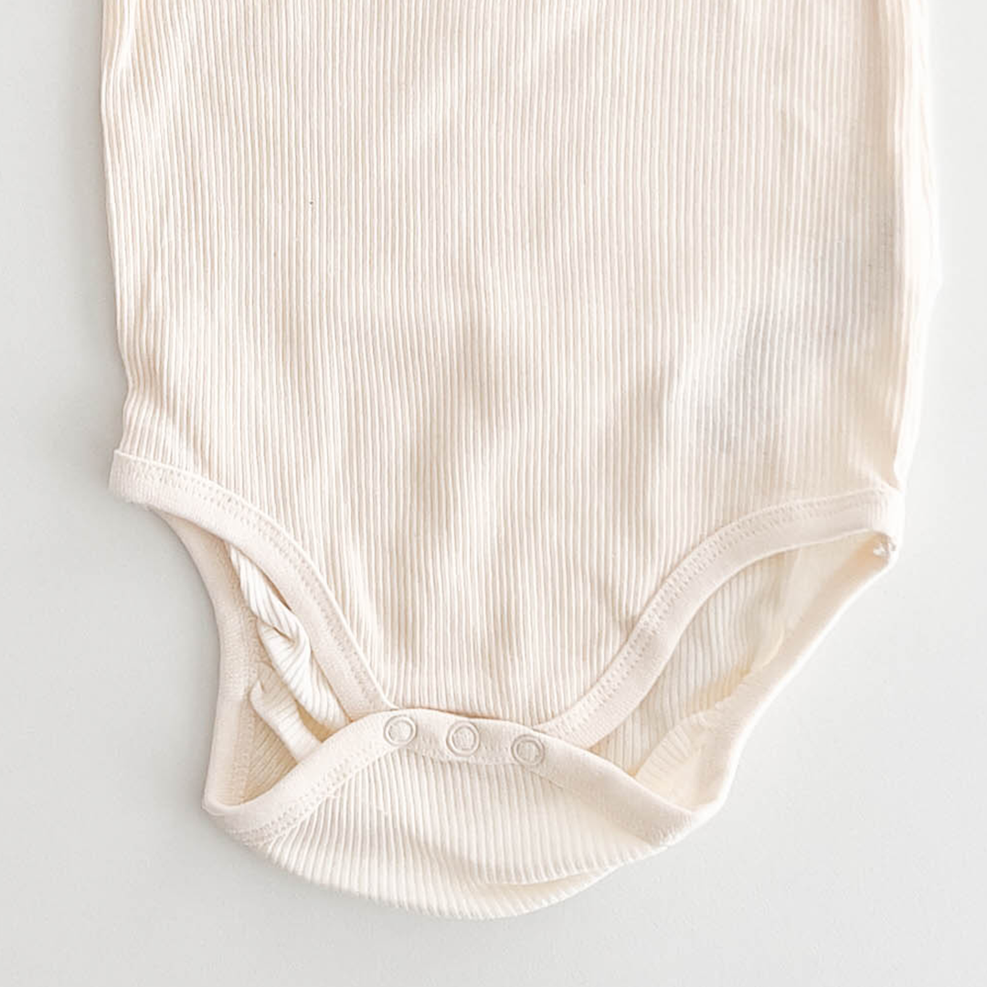 DISNEY OFF WHITE RIBBED ONESIE