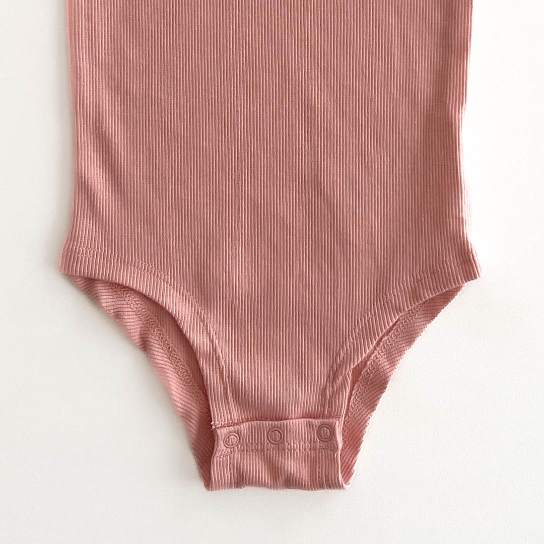 PEACH RIBBED ONESIE