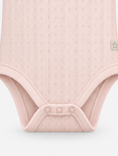 Baby pink pointelle ruffle onesie