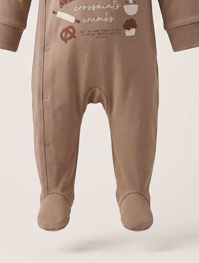 Light brown bakery wrap over sleep suit