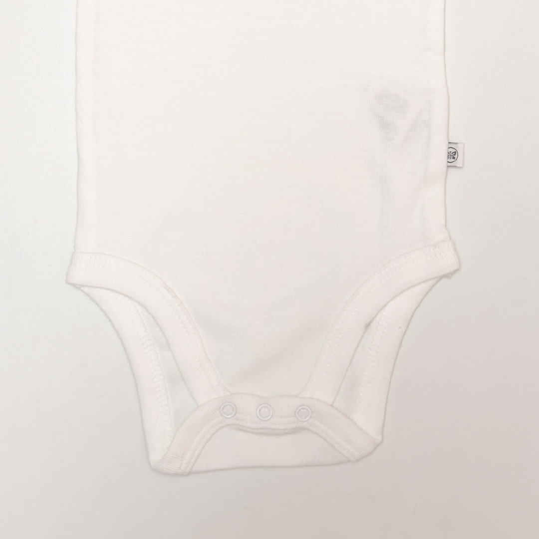 WHITE RUFFLE ONESIE