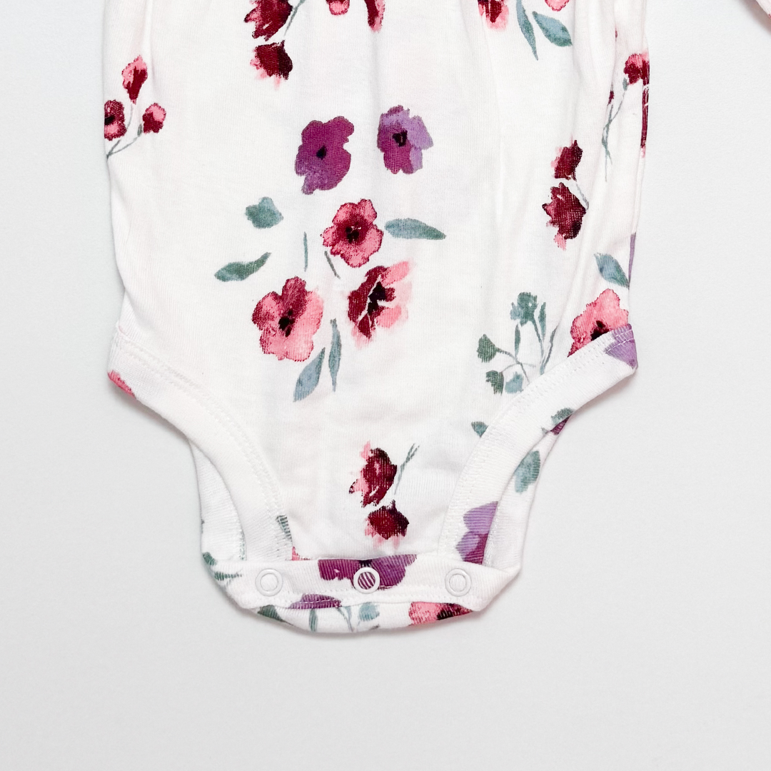 WHITE FLORAL RUFFLED ONESIE