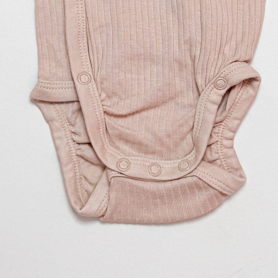 CREAM WRAPOVER RIBBED ONESIE
